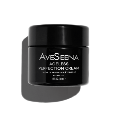 Black jar of AveSeena Ageless Perfection Cream on black background. Text in white and silver gives a sleek, luxurious feel. Size is 1.7 fl oz.